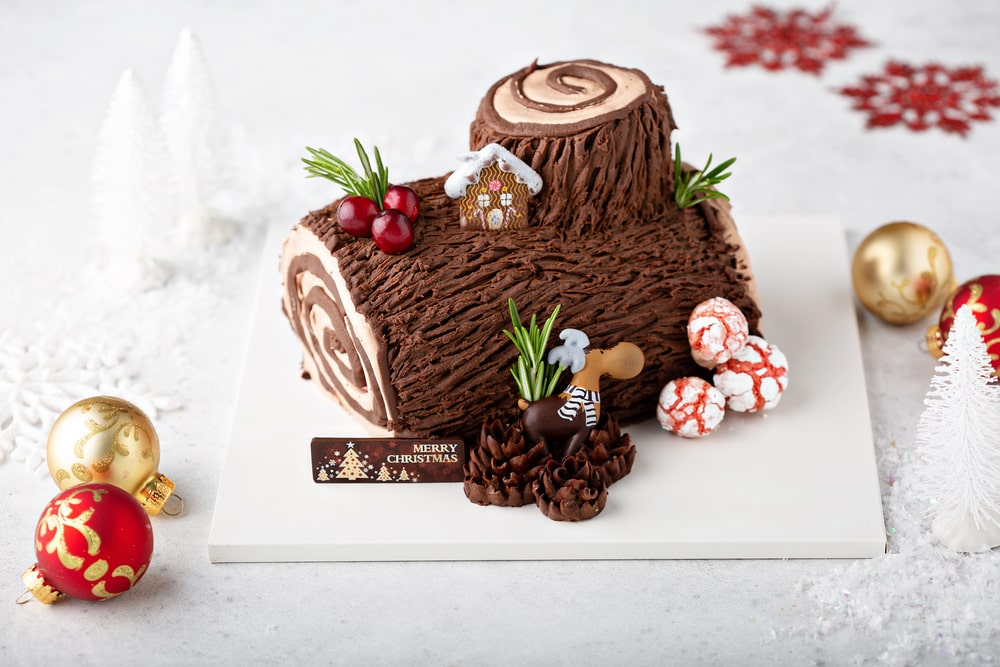 yule log cake on a white table